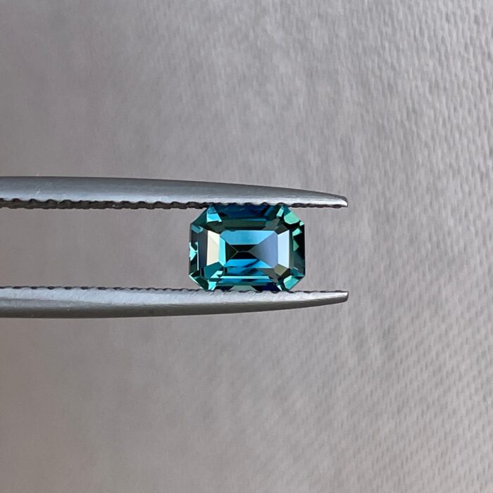 1.02 Carat Teal Sapphire gemstone with vibrant blue-green hues.